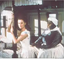  ?? New Line Cinema ?? VIVIEN LEIGH, left, and Hattie McDaniel in “GoneWith theWind,” the domestic box-office champ, which won eight competitiv­e Academy Awards.