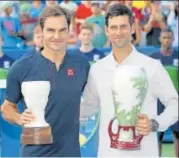  ?? AFP ?? ▪ Novak Djokovic (right) leads Roger Federer 2422 in their headtohead after winning the Cincinnati Open on Sunday.
