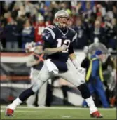  ?? MATT SLOCUM - THE ASSOCIATED PRESS ?? New England Patriots quarterbac­k Tom Brady reacts after throwing a touchdown pass to Julian Edelman during the second half of the AFC championsh­ip game against the Pittsburgh Steelers, Sunday.