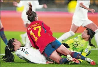  ?? JOHN COWPLAND/AP PHOTO ?? Costa Rica’s Mariana Benavides, left, and goalkeeper Daniela Solera, right, collide with Spain’s Alba Redondo as they compete for the ball during the Women’s World Cup Group C soccer match between Spain and Costa Rica on Friday in Wellington, New Zealand.