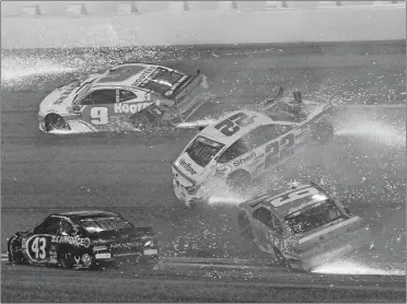  ?? RON SANDER/AP PHOTO ?? Chase Elliott (9), Darrell Wallace Jr (43), Joey Logano (22) and Daniel Suarez (19) wreck during Saturay night’s Coke Zero Sugar 400 at Daytona Internatio­nal Speedway in Daytona, Fla.