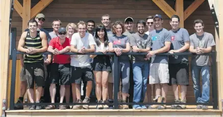  ?? JEAN LEVAC/OTTAWA CITIZEN ?? Students from Carleton University, Algonquin College and Queen’s University put final touches on their eco-home before taking it apart to ship to a competitio­n site in the U.S.