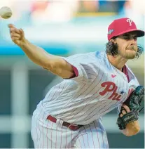  ?? MATT ROURKE/AP ?? Phillies starting pitcher Aaron Nola throws during the first inning of Game 3 of the NL Division Series against the Braves on Wednesday.