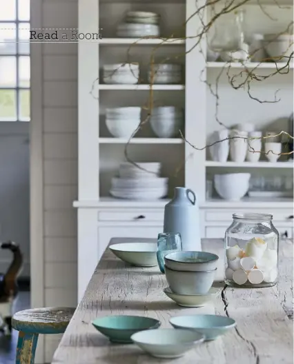  ??  ?? |TOP LEFT| White reflects light and creates an airy, open atmosphere, while the kitchen island’s grainy and cracking wood is a reminder of the natural world. The two elements combine to create a style rooted in minimalism.