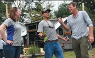  ?? SUBMITTED PHOTO ?? Rotelle Studio(e)’s owner and president Peter Rotelle, center, chats with television personalit­y Ty Pennington, right, and Rotelle’s Renee Pratt during the Rotelle Studio(e)’s unveiling of the He Shed, She Shed challenge sheds.