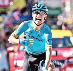  ??  ?? Nielsen celebrates as he crosses the finish line to win the 15th stage of the 105th edition of the Tour de France cycling race, between Millau and Carcassonn­e. — AFP photo