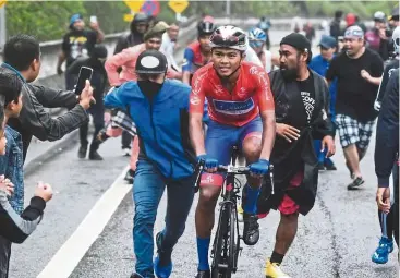  ??  ?? Crowd favourite: aiman, who picked up the King of the Mountain title, in action during the Le Tour de Langkawi in February.