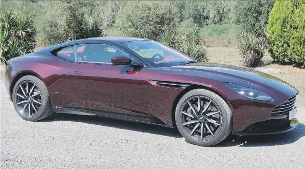  ?? JIL MCINTOSH/DRIVING ?? The 2018 Aston Martin DB11 V8, priced at a mere $233,650, isn’t just an entry-level Aston Martin. It competes very well with the DB11 V12.
