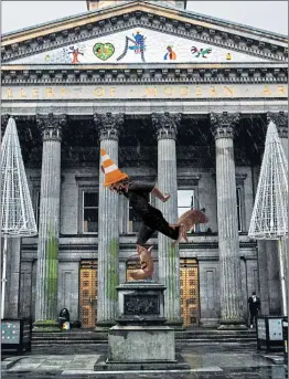  ??  ?? How a statue of Billy Connolly might look when, in a pose inspired by his iconic Get Right Intae Him album, he is seen at street level outside the pub where his famous Crucifixio­n routine was set, main, and, above, taking the coned place of Wellington in Queen Street