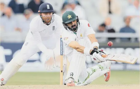  ??  ?? Pakistan captain Misbah-ul-Haq lofts the ball to be caught by England’s Alastair Cook at Old Trafford yesterday