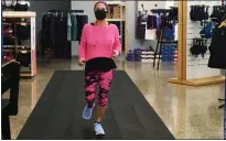  ??  ?? Aldona Stungys shows her gait and stride while running on the track in the Achilles Running Shop in Willoughby.