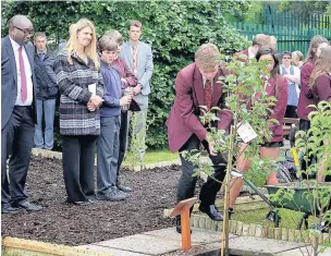  ??  ?? ●● Tytheringt­on Year 11 pupils previously paid tribute to teacher Guy Wharton (right) by planting an apple tree in the school garden