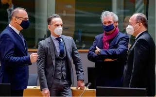  ?? AP ?? (From left) Croatia Foreign Affairs minister of Gordan Grlic Radman speaks to his German counterpar­t Heiko Maas, Luxembourg counterpar­t Jean Asselborn and Romanian counterpar­t Bogdan Aurescu, during a EU Foreign Affairs Ministers meeting at the European Council building in Brussels on Monday. —