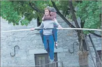  ?? SONY PICTURES ENTERTAINM­ENT VIA AP ?? Charlotte Le Bon (right) as Annie and Joseph Gordon-Levitt as Philippe Petit in a scene from TriStar Pictures’ “The Walk.” “The Walk,” is a fictionali­zed rendering of Philippe Petit’s 1974 high-wire stroll between the World Trade Center towers.