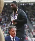  ??  ?? LONDON: IAAF President Sebastian Coe leaves after he awarded the gold medal for the men’s 100-meter final to United States’ Justin Gatlin during the World Athletics Championsh­ips in London Sunday. —AP