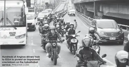  ??  ?? Hundreds of Angkas drivers took to EDSA to protest an impendent crackdown on the habalhabal service. PHILSTAR.COM