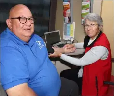  ??  ?? Martin Haughton of Wexford Working Men’s Shed has his blood preasure checked by Carol Pye of the Irish Heart Foundation.