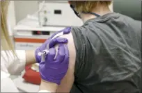  ?? University of Maryland School of Medicine photo via AP ?? The first patient enrolled in Pfizer’s COVID19 coronaviru­s vaccine clinical trial at the University of Maryland School of Medicine in Baltimore, receives an injection on May 4.