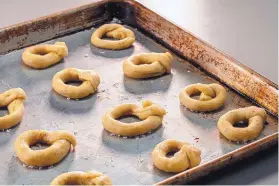  ??  ?? The taralli don’t spread much so you don’t have to space them that far apart.