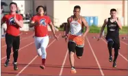  ?? RECORDER PHOTOS BY CHIEKO HARA ?? Portervill­e High School's Demario Ennis, second from right, leads the boys 100-meter race Thursday at the PUSD City Meet at Jacob Rankin Stadium.