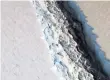  ?? NASA ?? A 70-milelong crack in an ice shelf off Antarctica could produce an iceberg about the size of Delaware, NASA says.