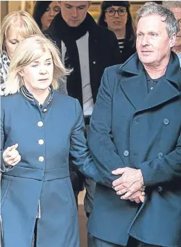  ??  ?? Victim Linda McDonald, who was attacked by Robbie McIntosh, right, leaves the High Court in Edinburgh with husband Matthew.