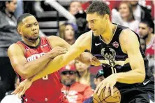  ?? Melissa Phillip / Staff photograph­er ?? Eric Gordon, left, is expected to play at Chicago tonight after missing Wednesday’s game with a sore left hamstring.