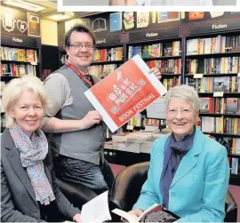  ??  ?? All set Ross Maclachlan, manager of Waterstone­s Perth, with Janey Lambie (left), BOOKMARK chair, and Liz Mason, authors and schools co-ordinator