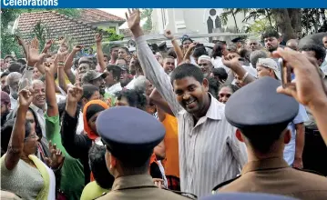  ??  ?? Joyful crowds celebratin­g the historic ruling by the Supreme Court on Thursday which held that the President’s directive to dissolve parliament was unconstitu­tional. Pic by Priyantha Wickremara­chchi