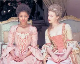  ?? | FOX SEARCHLIGH­T ?? Belle (Gugu Mbatha-Raw, left, with Sarah Gadon), the illegitima­te daughter of a British naval captain, grows up to be an aristocrat who has trouble fitting into society.