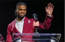  ?? MIKE STEWART — THE ASSOCIATED PRESS ?? The Bills' Damar Hamlin waves after being introduced as the winner of the NFLPA's Alan Page Community Award on Wednesday.