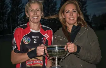  ??  ?? Louth County Board chairperso­n Lorraine Young, presented the Fr Soraghan cup to St Kevins Captain Linda Fagan. Picture: Warren Matthews