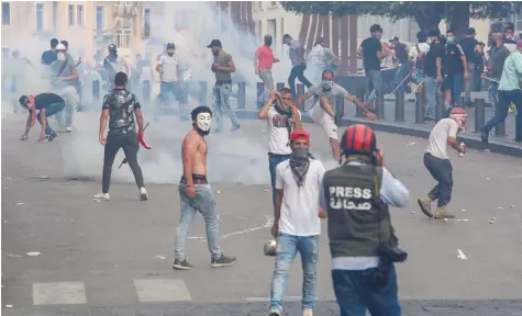  ?? (Reuters) ?? PROTESTERS DEMONSTRAT­E in Beirut, where Iranian-backed Hezbollah has tried to intervene more in politics.