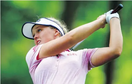  ?? BUTCH DILL / THE ASSOCIATED PRESS ?? Brooke Henderson of Smiths Falls, Ont., made history on Sunday when the 20-year-old became the first Canadian to win the national women’s golf championsh­ip in 45 years.