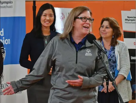  ?? CHRIS CHRISTO — BOSTON HERALD ?? Mayor Michelle Wu and BPS Superinten­dent Mary Skipper listen to CEO of Special Olympics Massachuse­tts Mary Beth McMahon during announceme­nt at Brighton High School.