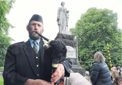  ?? PHOTO: DANIEL BIRCHFIELD ?? Family ties . . . Jock Scott, greatnephe­w of Dr Margaret Cruickshan­k, plays the bagpipes at a wreathlayi­ng ceremony in Seddon Square, Waimate, to commemorat­e 100 years since her death.