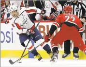  ?? GERRY BROOME — ASSOCIATED PRESS ?? The Capitals’ Alex Ovechkin (8) skates by Carolina’s Brett Pesce. The Washington star scored twice in the victory.