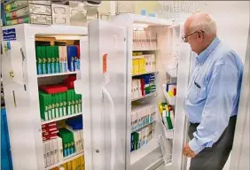  ?? Paul Buckowski / Times Union ?? Frank Rice, president and CEO of Integrated Tissue Dynamics, shows the freezers filled with boxes containing 100 slides or more of skin samples at the company’s Rensselaer lab on Tuesday.