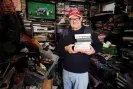  ?? Photograph: Christophe­r Thomond/The Guardian ?? Billy Cunliffe at home with his huge collection of VHS tapes, vinyl records, cassettes and reel-to-reel tapes.