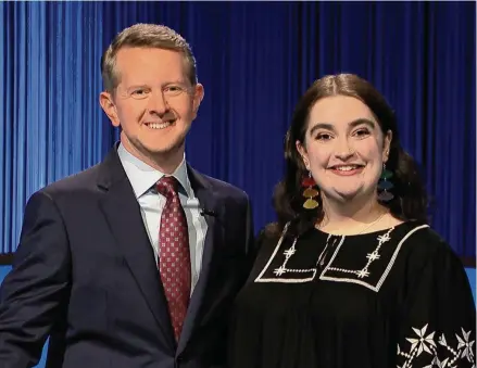  ?? Courtesy of Kate Campolieta ?? Jeopardy! contestant Kate Campolieta, from Simsbury, stands with host Ken Jennings during her first appearance in July 2023.