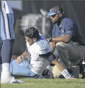  ?? PHELAN M. EBENHACK / ASSOCIATED PRESS ?? Titans quarterbac­k Marcus Mariota suffered a broken right leg in the third quarter of Tennessee’s 38-17 loss to the Jaguars and is out for the rest of the season.