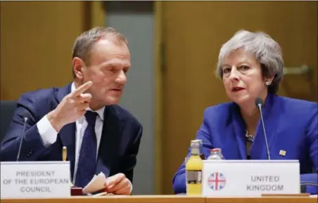  ?? OLIVIER HOSLET PHOTO VIA AP ?? British Prime Minister Theresa May, right, and European Council President Donald Tusk attend a round table meeting Sunday at an EU summit in Brussels. European Union leaders are gathering to seal an agreement on Britain’s departure from the bloc next year, the first time a member country will have left the 28-nation bloc.