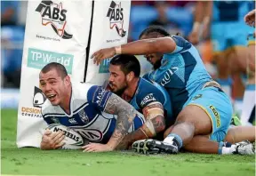  ??  ?? David Klemmer scores for the Bulldogs.