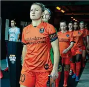  ??  ?? Wearing the captain’s arm band, Nairn takes the field for her last match — a 5-1 win over Tigres Femenil.