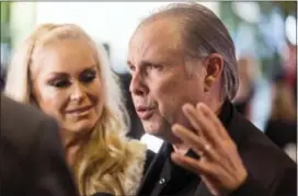  ??  ?? In a March 25 photo, Todd Fisher and Catherine Hickland, left, arrive at the Carrie Fisher and Debbie Reynolds Memorial Service at The Forest Lawn, in Los Angeles.