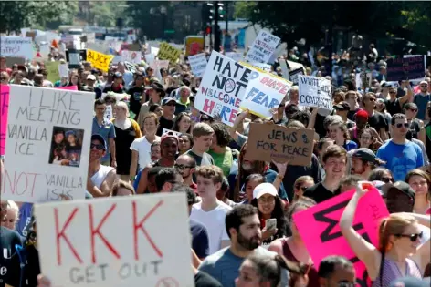  ??  ?? Counterpro­testers stand on the periphery of a “Free Speech” rally staged by conservati­ve activists on Boston Common on Saturday in Boston. One of the planned speakers of a conservati­ve activist rally that appeared to end shortly after it began says the...