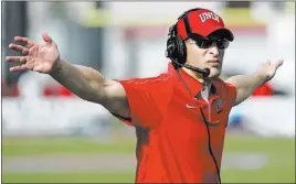  ?? DAVID CLEVELAND/ LAS VEGAS REVIEW-JOURNAL ?? UNLV football coach Bobby Hauck, shown against UNR last season at Sam Boyd Stadium, has a favorable schedule that should allow his Rebels to top their predicted 2½-win total.