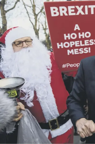  ??  ?? 0 From left: Michael Gove is accosted by a protester at Westminste­r; anti-brexit campaigner­s wave flags outside parliament; EU chief Brexit negotiator Michel Barnier, left, meets European Council president Donald Tusk in Brussels