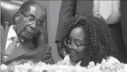  ?? TSVANGIRAY­I MUKWAZHI, THE ASSOCIATED PRESS ?? Zimbabwe’s President Robert Mugabe, seen with his daughter Bona, has been in power for 37 years and his increasing­ly arbitrary actions have wrecked the economy, Gwynne Dyer writes.