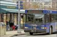  ?? FILE PHOTO ?? Riders wait for the bus at the CDTA Uncle Sam Bus Stop in Troy.